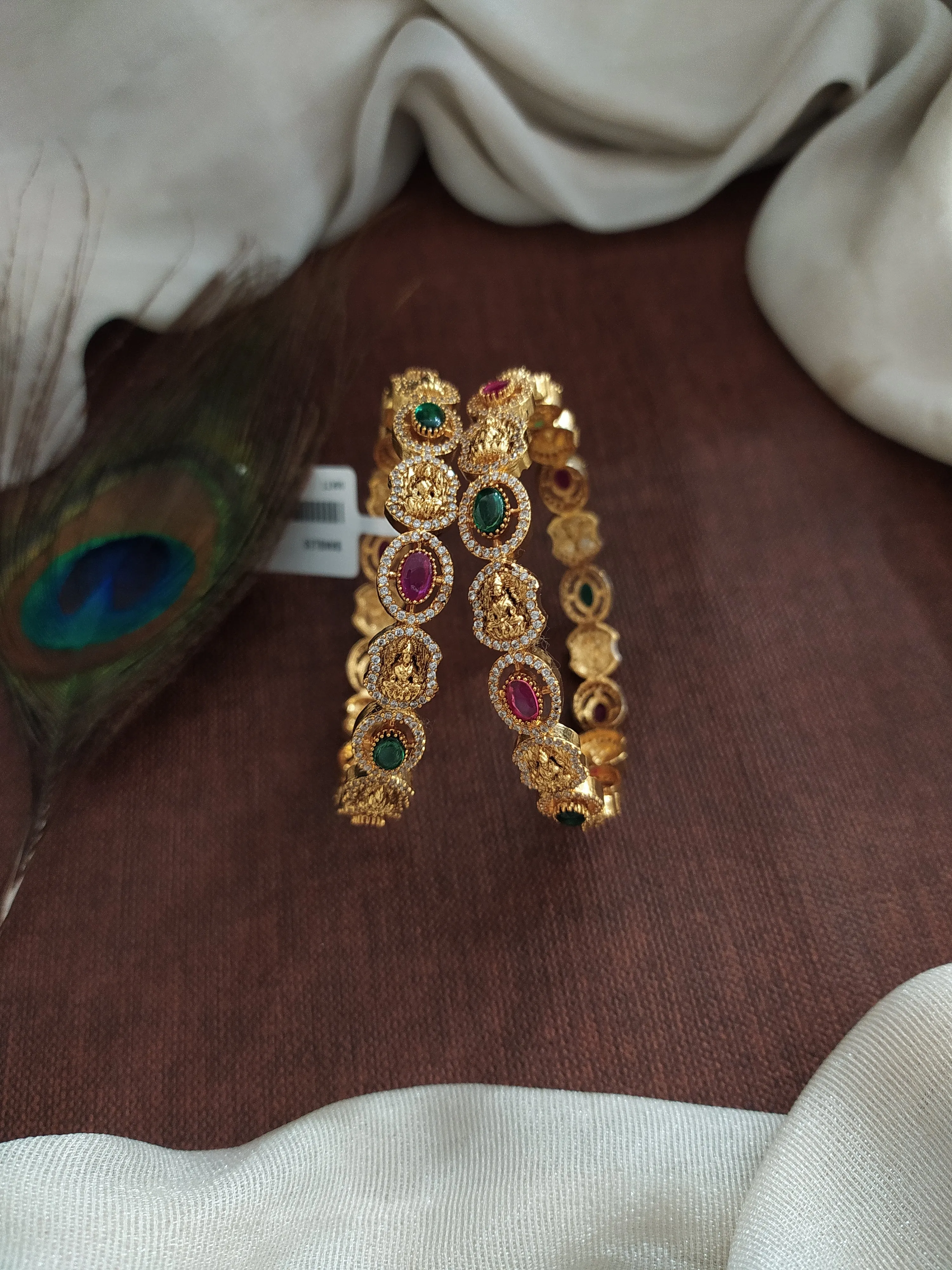 "Oval-Shaped Antique Lakshmi Bangles with Kemp, Green, and White Zircon Stones"