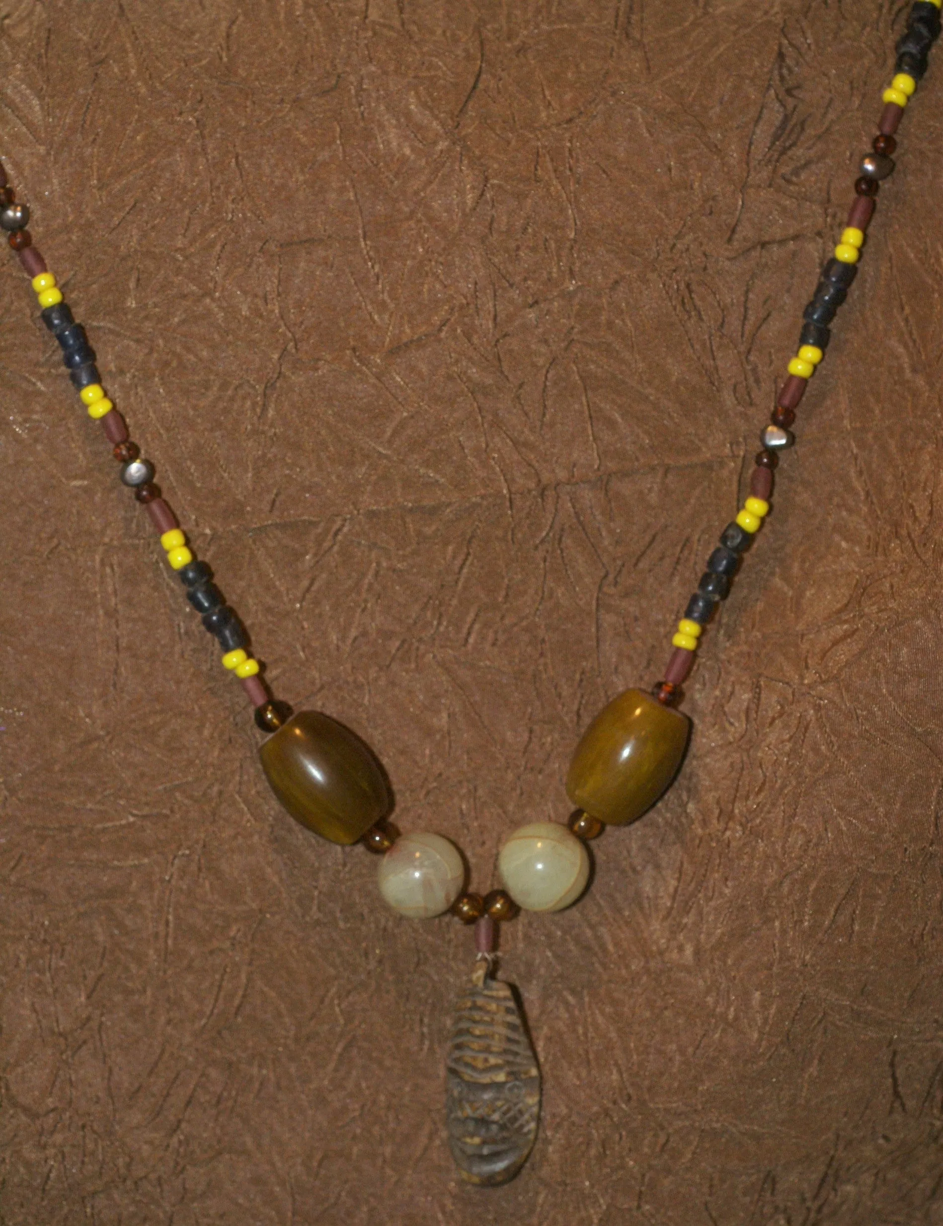 Unique Earthtones Hand crafted Ethnic Glass Trade Beads Necklace with Buffalo Bone Hand Carved Pendant of Protective Ancestor for Good Luck, Borneo Kalimantan, Indonesia NECK32   1 Flapper Coconut necklace.