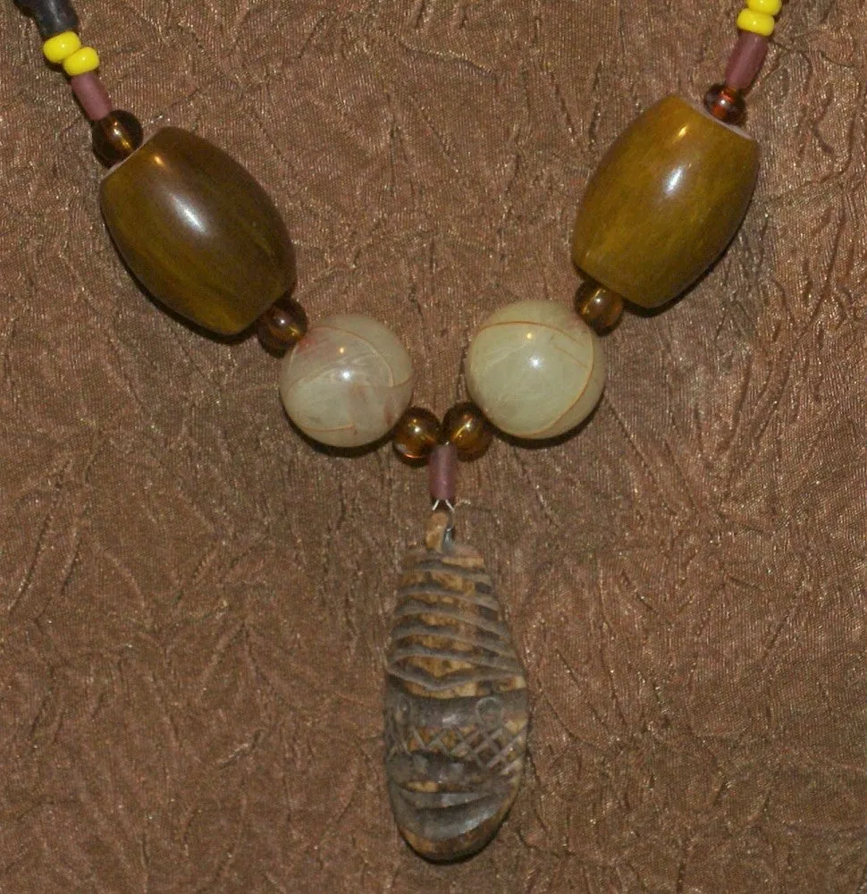 Unique Earthtones Hand crafted Ethnic Glass Trade Beads Necklace with Buffalo Bone Hand Carved Pendant of Protective Ancestor for Good Luck, Borneo Kalimantan, Indonesia NECK32   1 Flapper Coconut necklace.