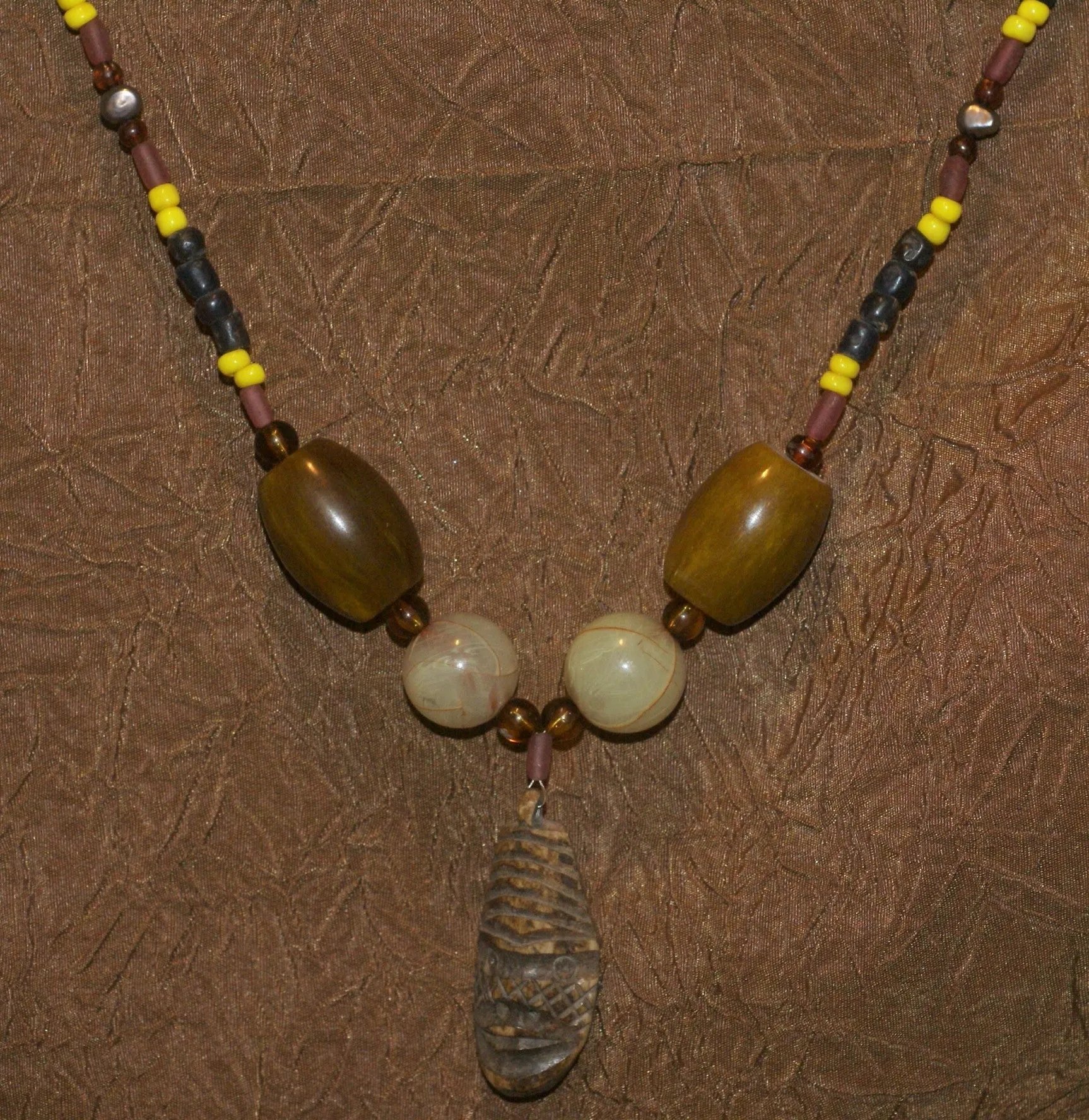 Unique Earthtones Hand crafted Ethnic Glass Trade Beads Necklace with Buffalo Bone Hand Carved Pendant of Protective Ancestor for Good Luck, Borneo Kalimantan, Indonesia NECK32   1 Flapper Coconut necklace.
