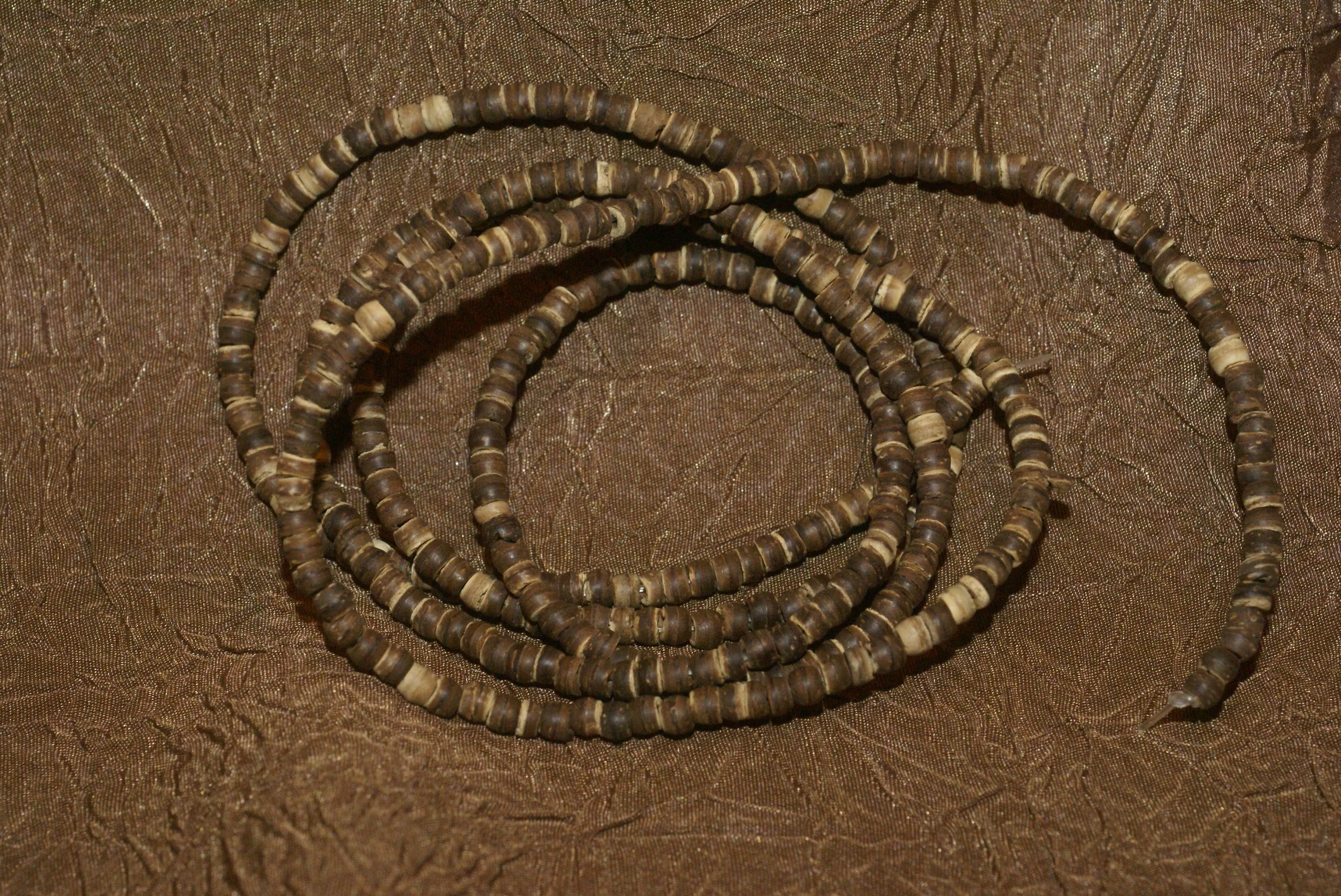 Unique Earthtones Hand crafted Ethnic Glass Trade Beads Necklace with Buffalo Bone Hand Carved Pendant of Protective Ancestor for Good Luck, Borneo Kalimantan, Indonesia NECK32   1 Flapper Coconut necklace.