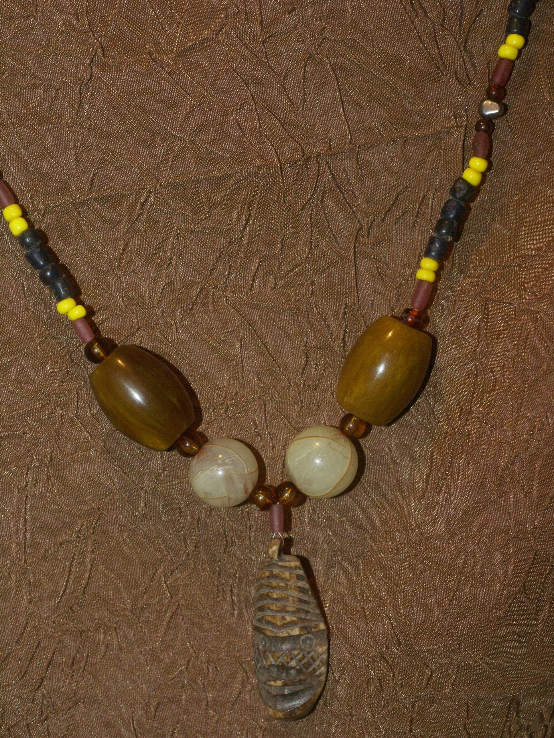 Unique Earthtones Hand crafted Ethnic Glass Trade Beads Necklace with Buffalo Bone Hand Carved Pendant of Protective Ancestor for Good Luck, Borneo Kalimantan, Indonesia NECK32   1 Flapper Coconut necklace.
